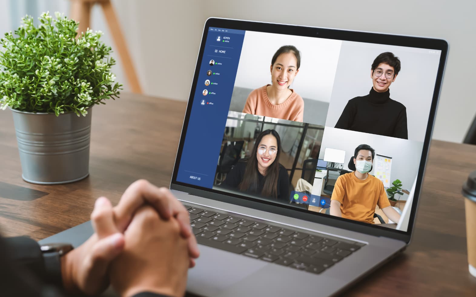 A video call taking place on a laptop