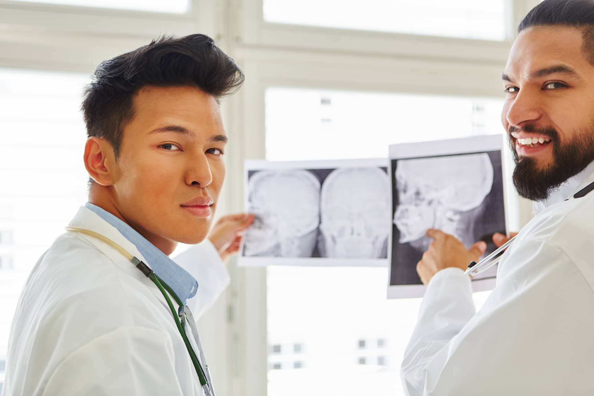 Two doctors examining x-ray charts