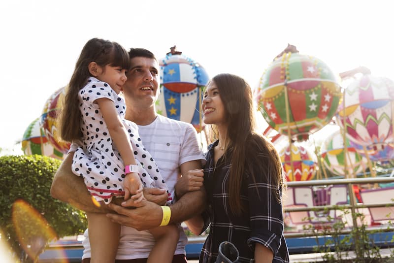 A young family at an amusement park